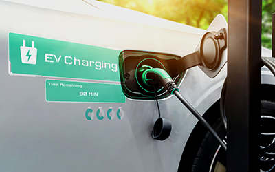 EV charging station for electric car in concept of alternative green energy produced from sustainable resources to supply to charger station in order to reduce CO2 emission .